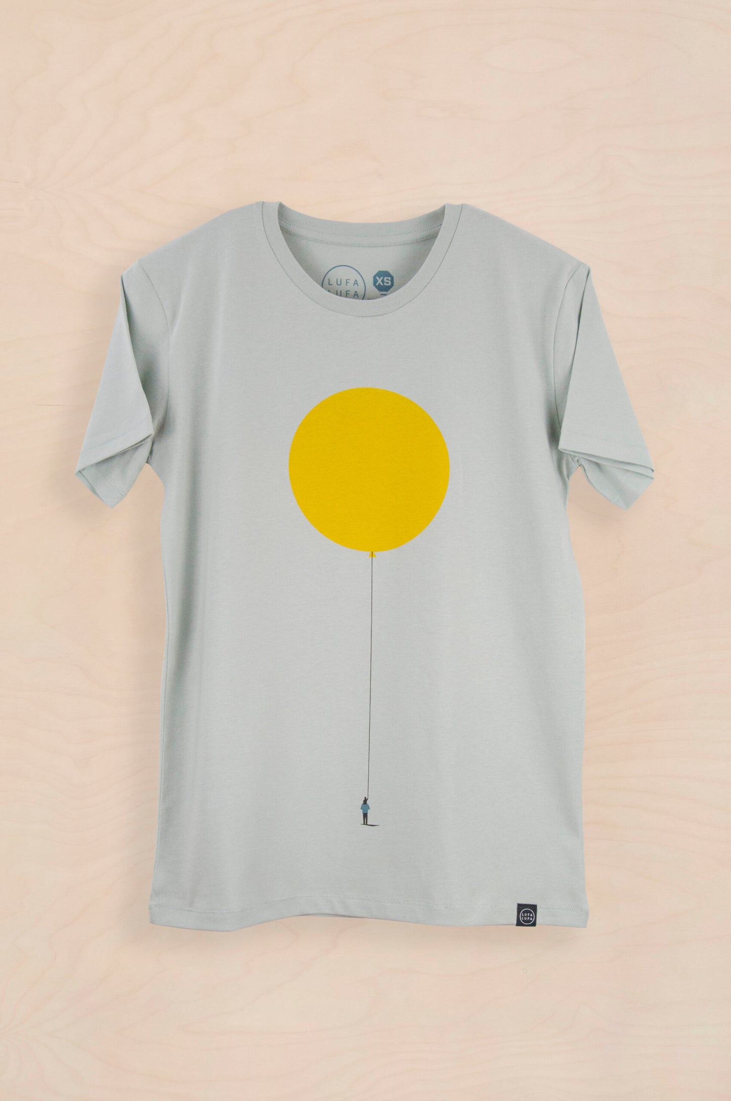 t-shirt of father hanging balloon with child on his back